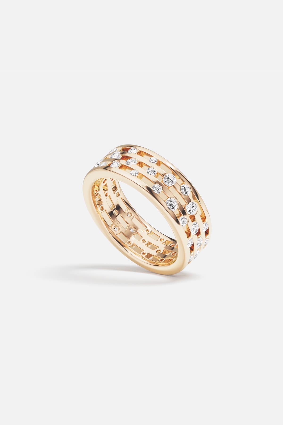 APM Ring in golden color, an openwork band scattered with luminous sparkle.