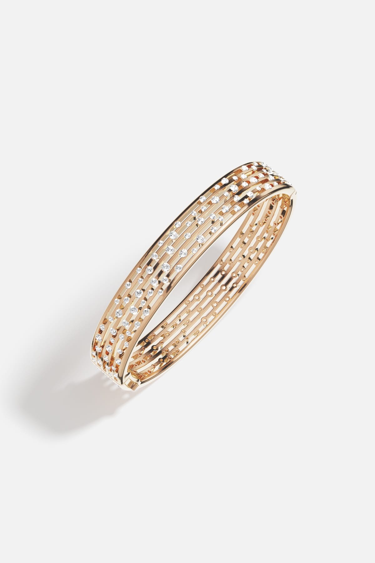 APM Monaco bangle in golden alloy, scattered with stardust sparkle for effortless elegance.