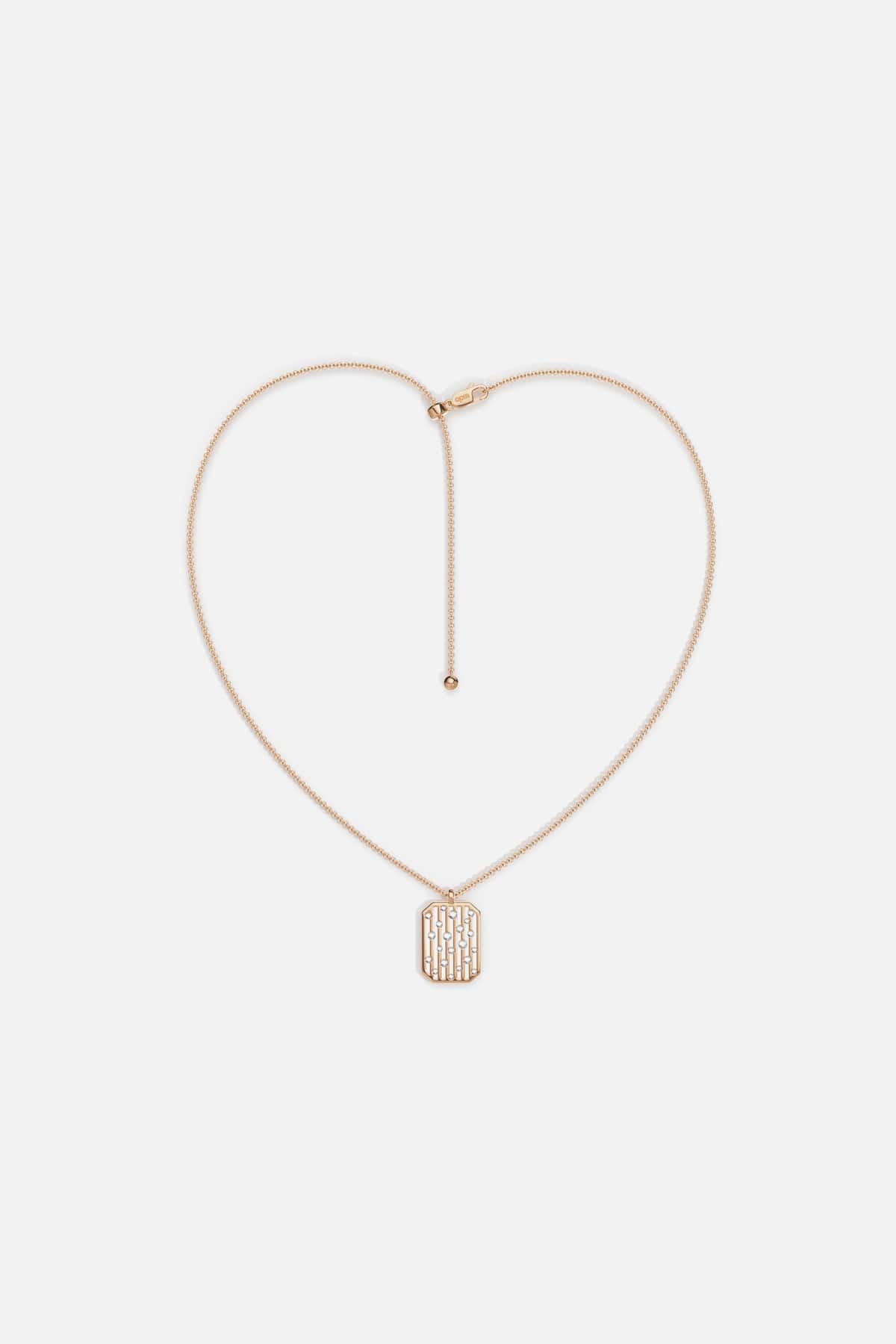 APM pendant necklace in rose gold color, a quietly modern signature.
