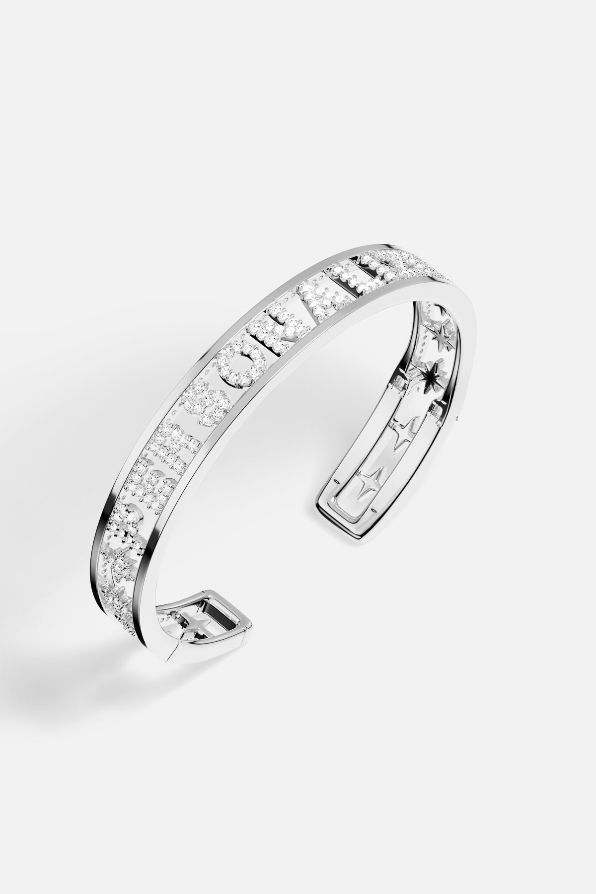 APM Monaco cuff bracelet, a shimmering statement in rhodium finish.