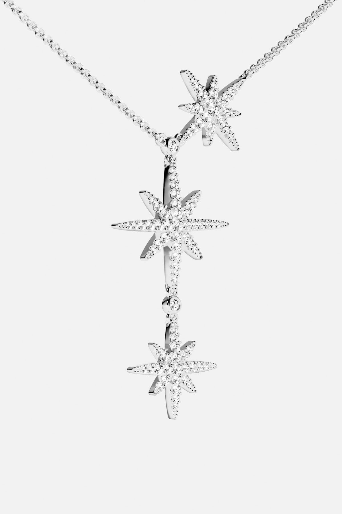 APM Météorites Necklace, three cascading stars in rhodium finish, celestial elegance in motion.