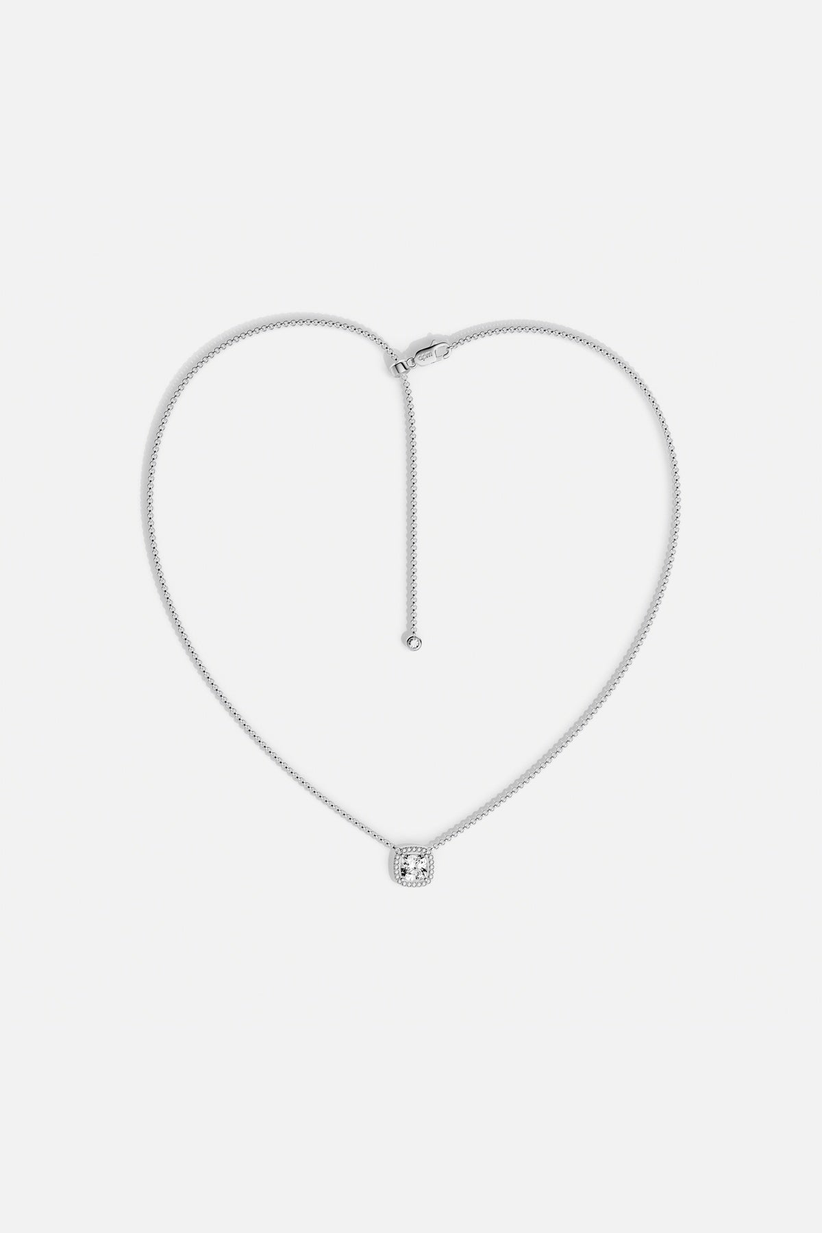 APM Necklace with a luminous cushion pendant, quiet elegance in rhodium finish.