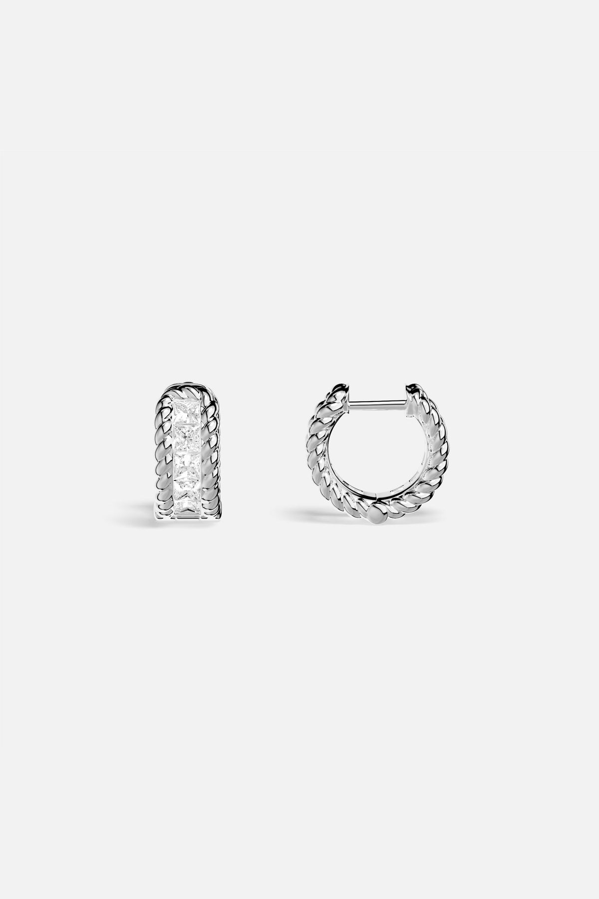 APM Hoop Earrings, twisted rhodium finish framing a luminous crystal line.