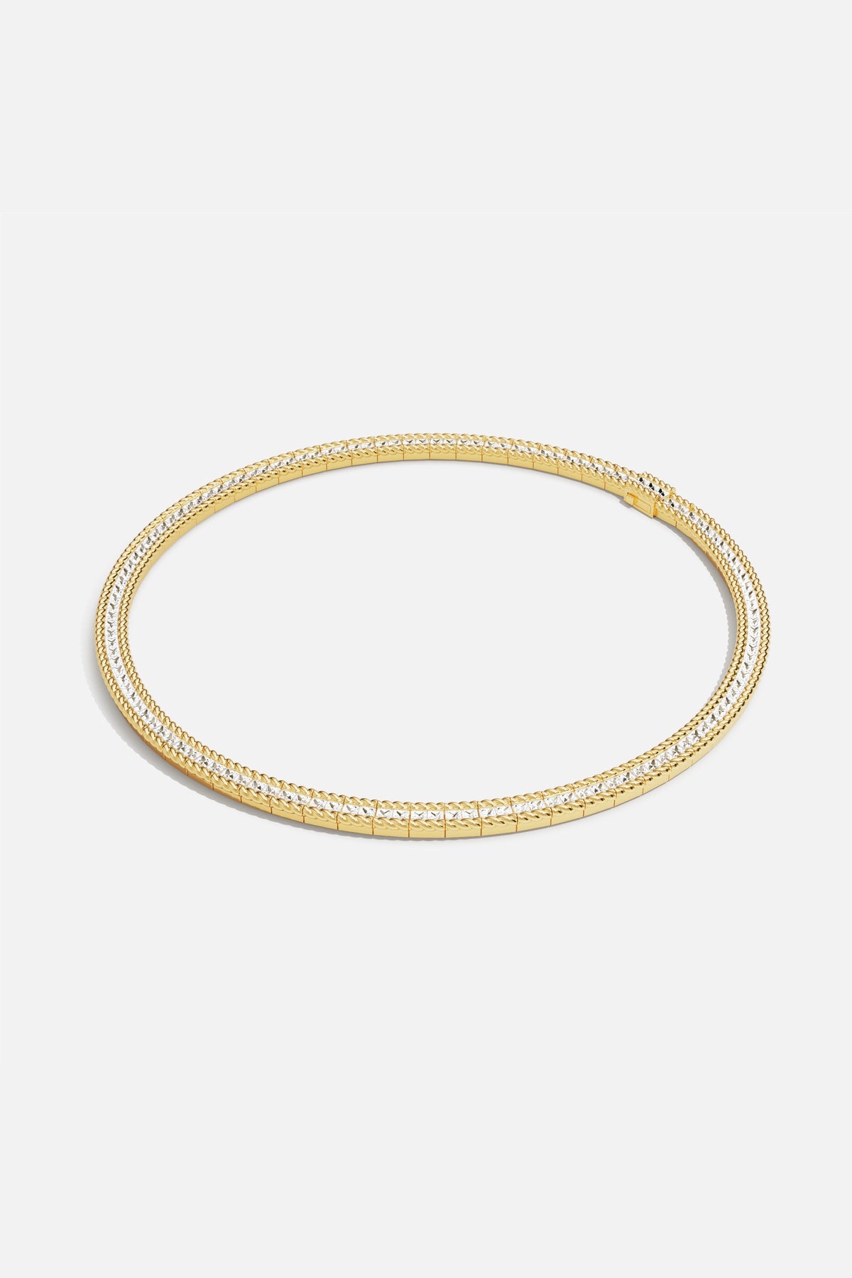 APM Necklace in golden hues, a sleek statement of modern elegance.