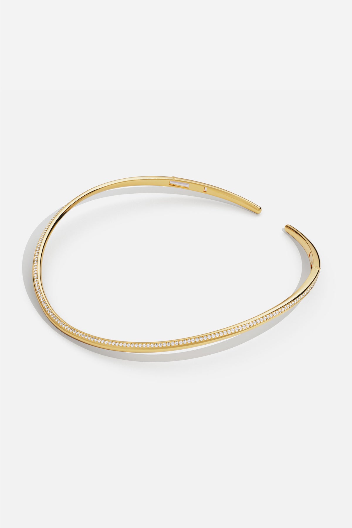 APM Choker in gold color, a sleek curve of modern elegance.