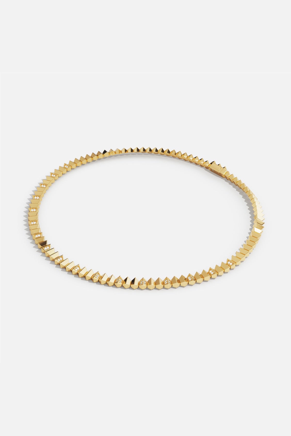 APM Necklace in gold color, sharp elegance with a bold modern edge.