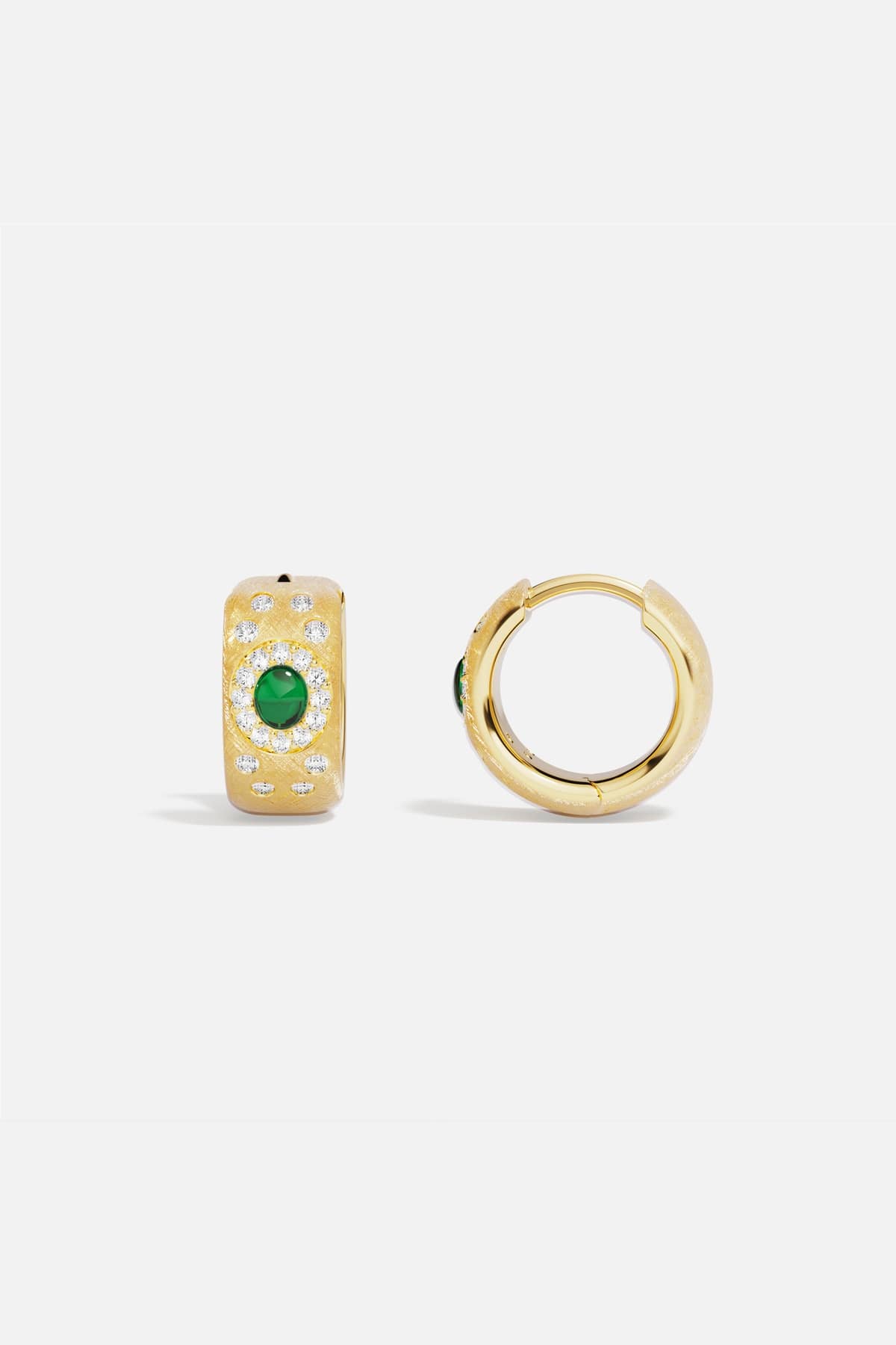 APM Hoop Earrings, golden warmth centered by a vivid green glow.