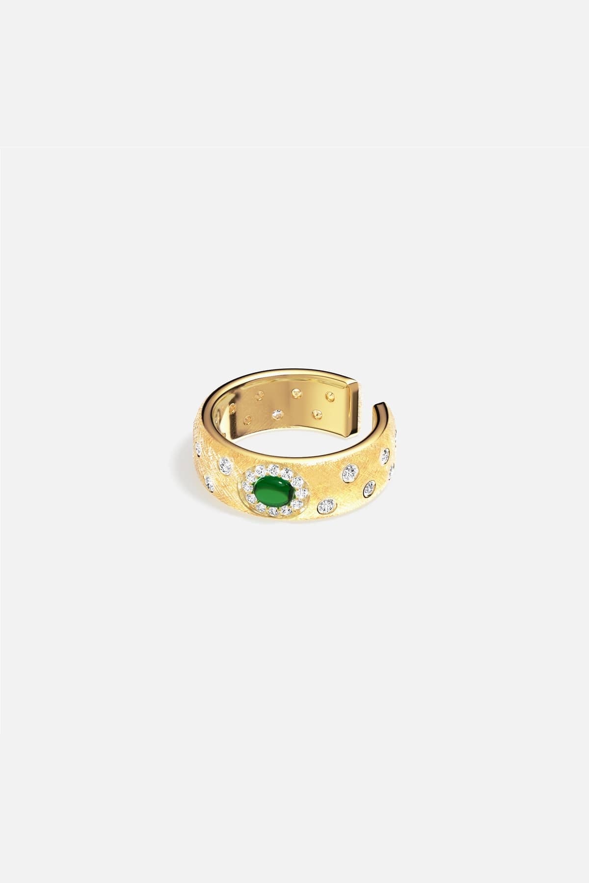APM Ring in golden hue, a green stone glowing with quiet elegance.