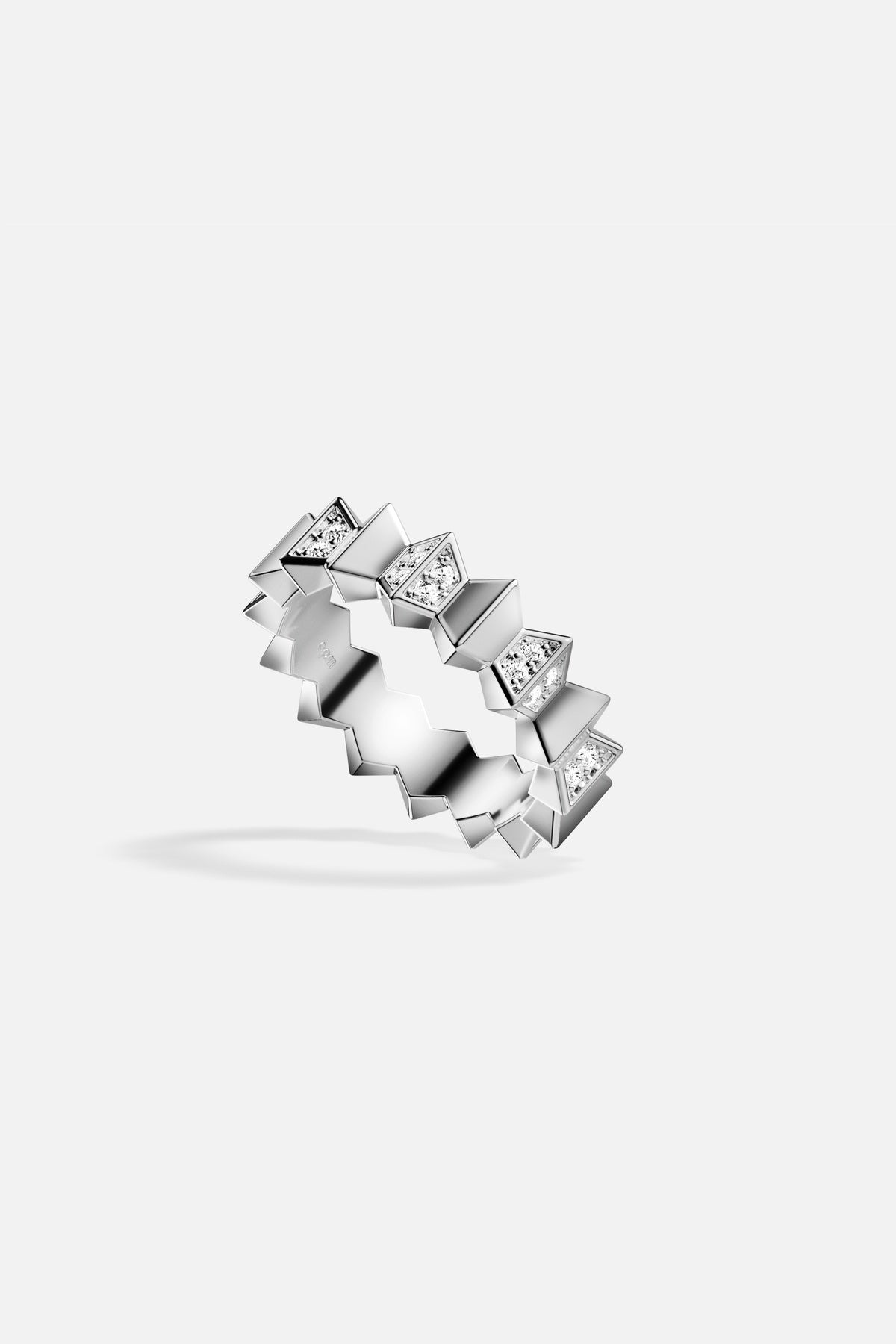 APM Ring, a bold zigzag rhythm shimmering in rhodium finish brilliance.