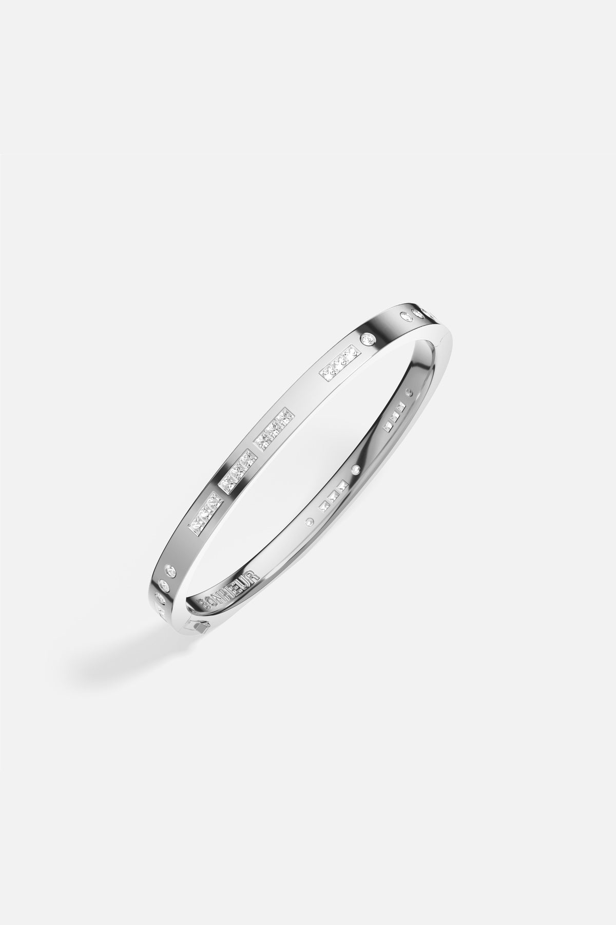 APM Bonheur Bangle in rhodium finish, sleek modernity with a whisper of sparkle.