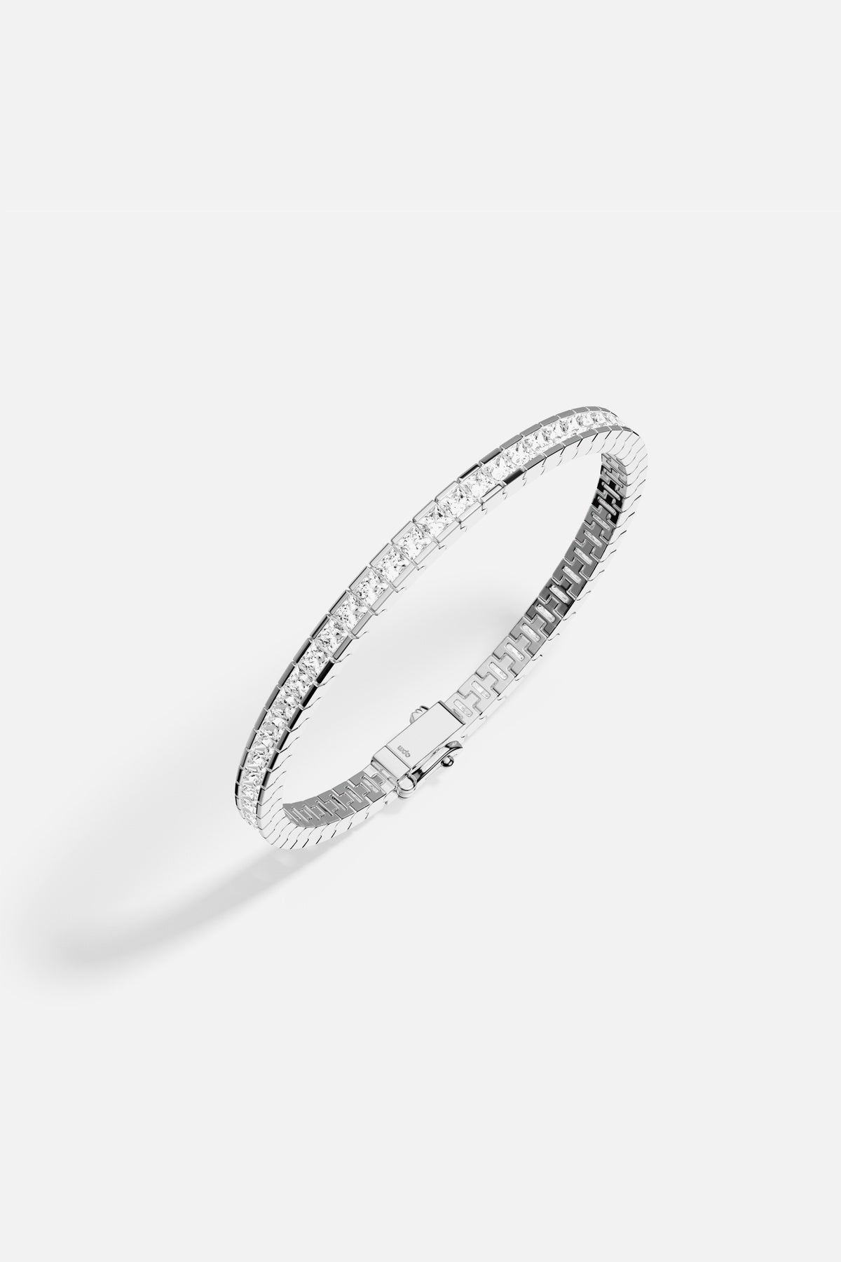 APM Tennis Bracelet, a sleek line of brilliance in rhodium finish.