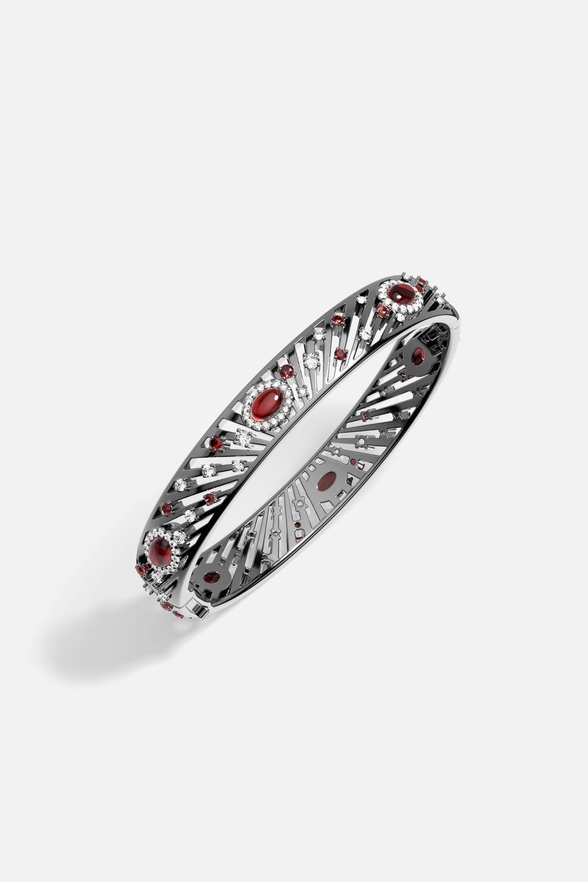 APM Bangle in rhodium finish, radiant with crimson glow and quiet celestial charm.