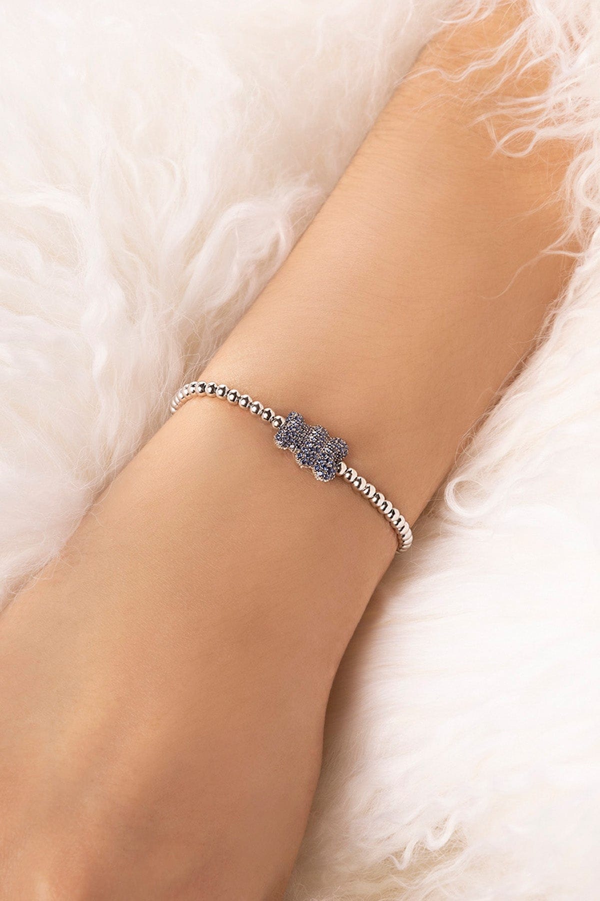 APM MONACO baby yummy bear bracelet with beads in silver worn on model's wrist