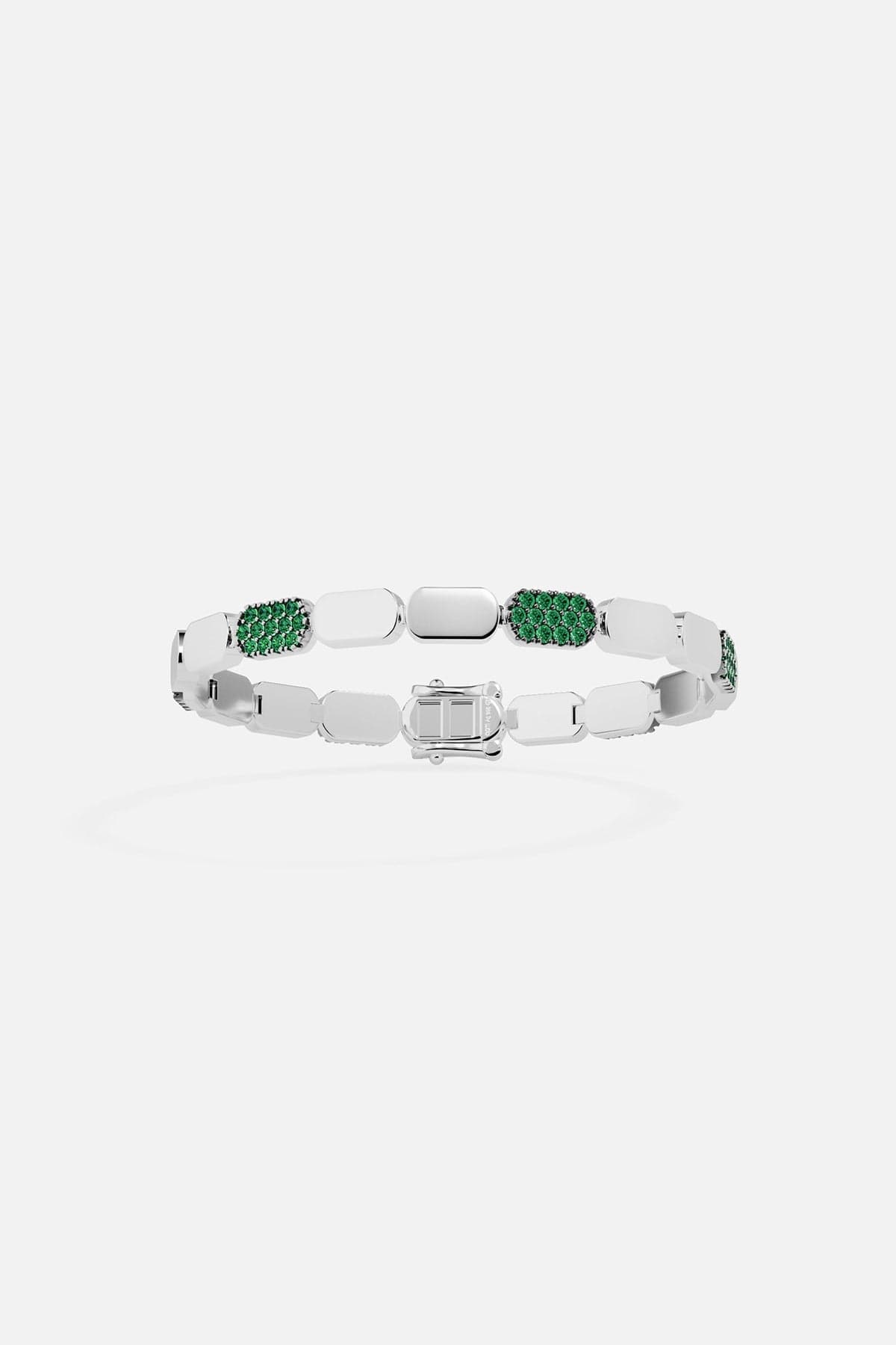 Silver bracelet with green stones on a white background