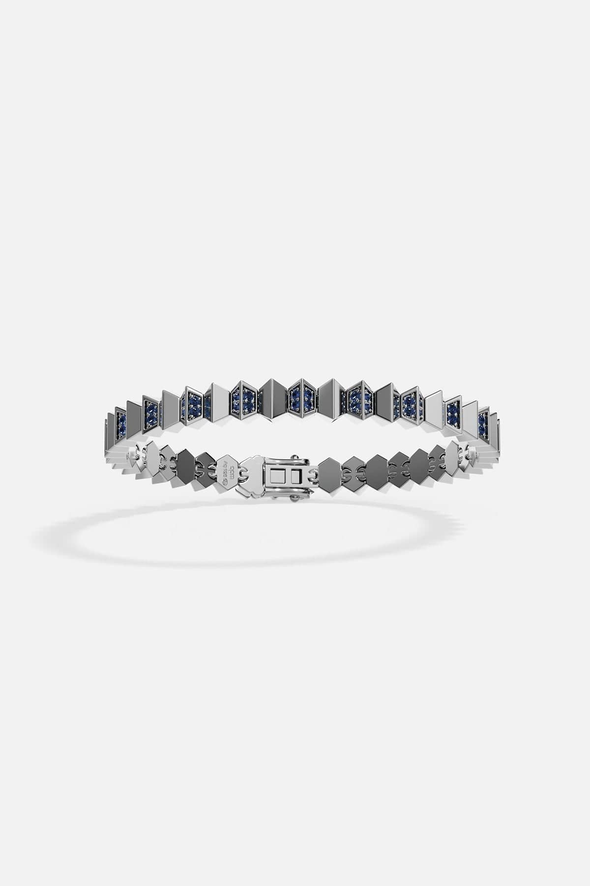 Silver bracelet with geometric design on a white background