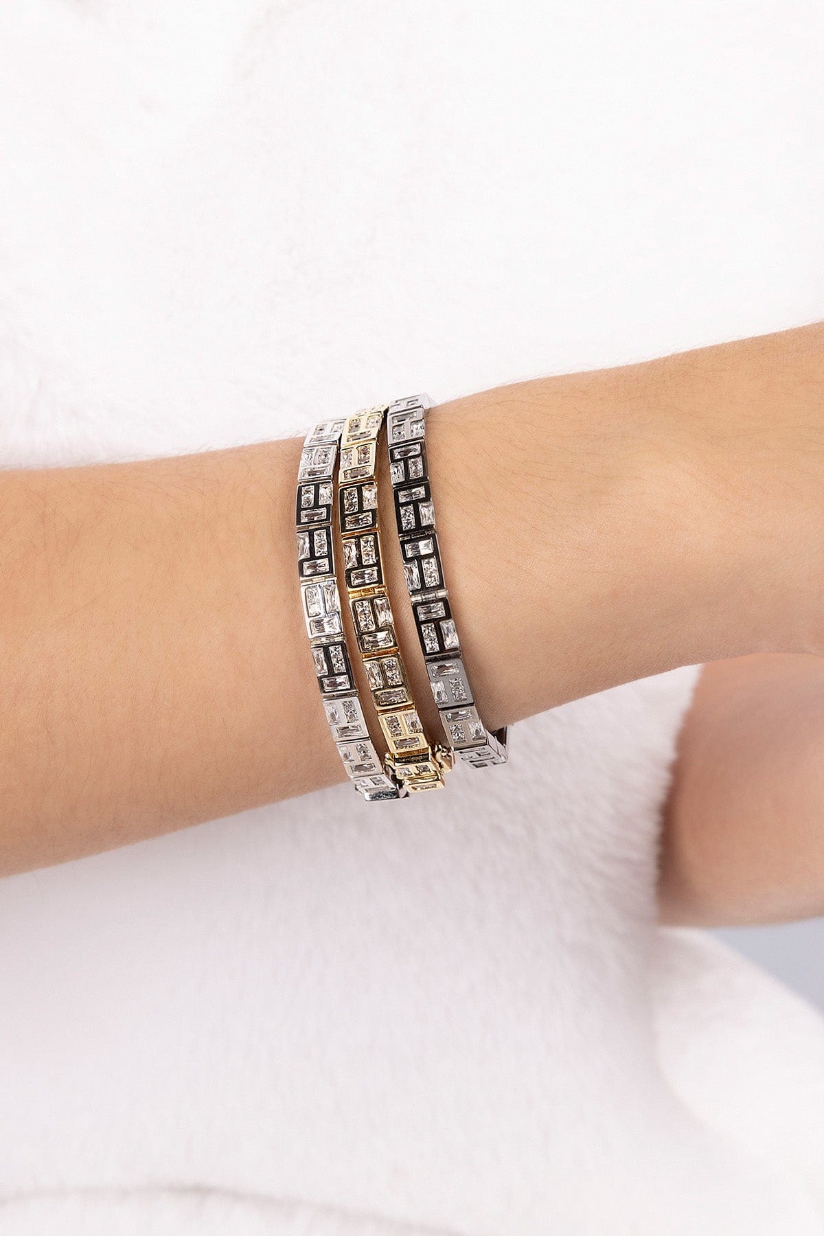 APM MONACO labyrinth bracelet in silver wearing on wrist