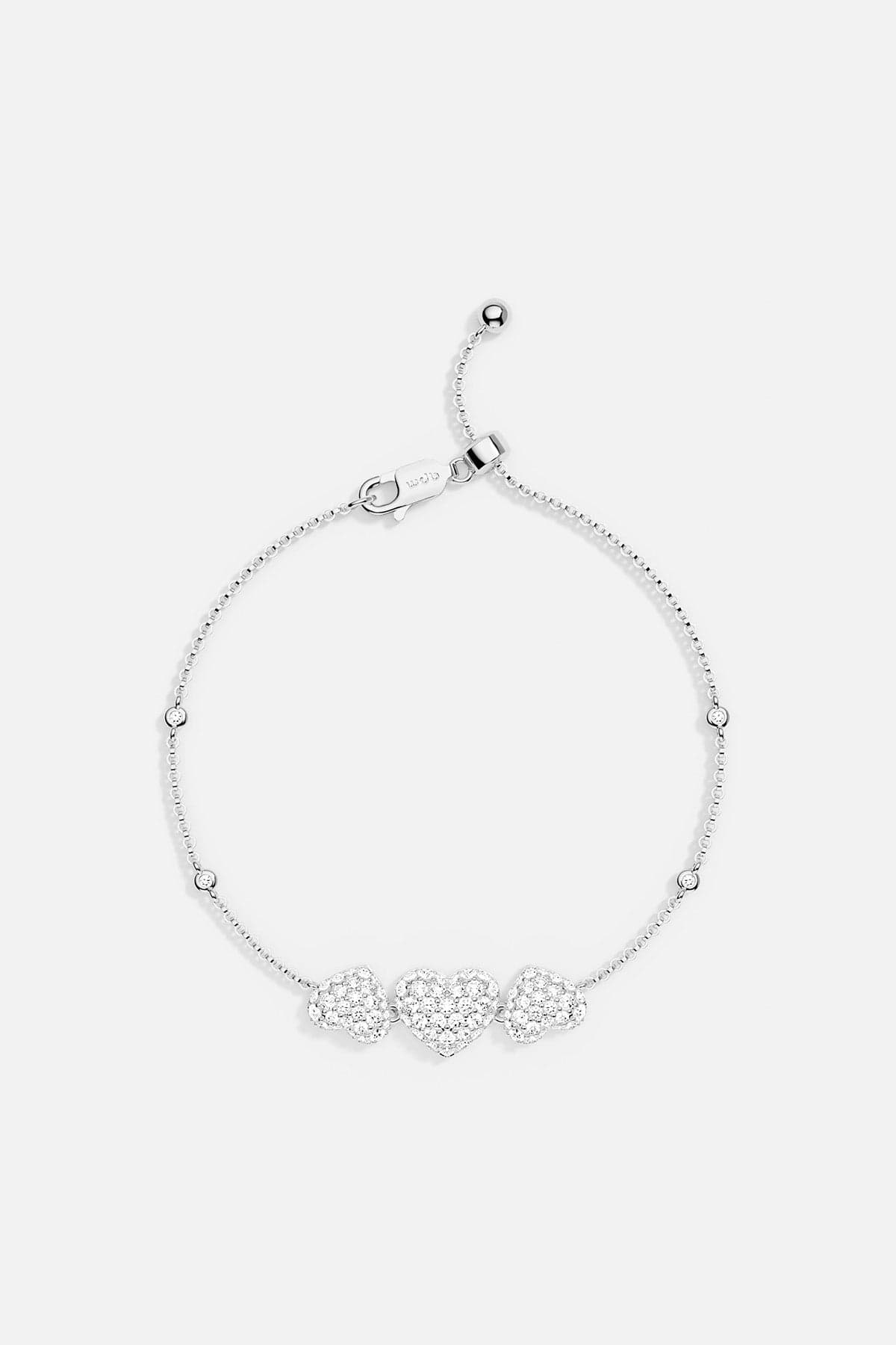 APM MONACO heart-shaped adjustable bracelet in silver on a white background