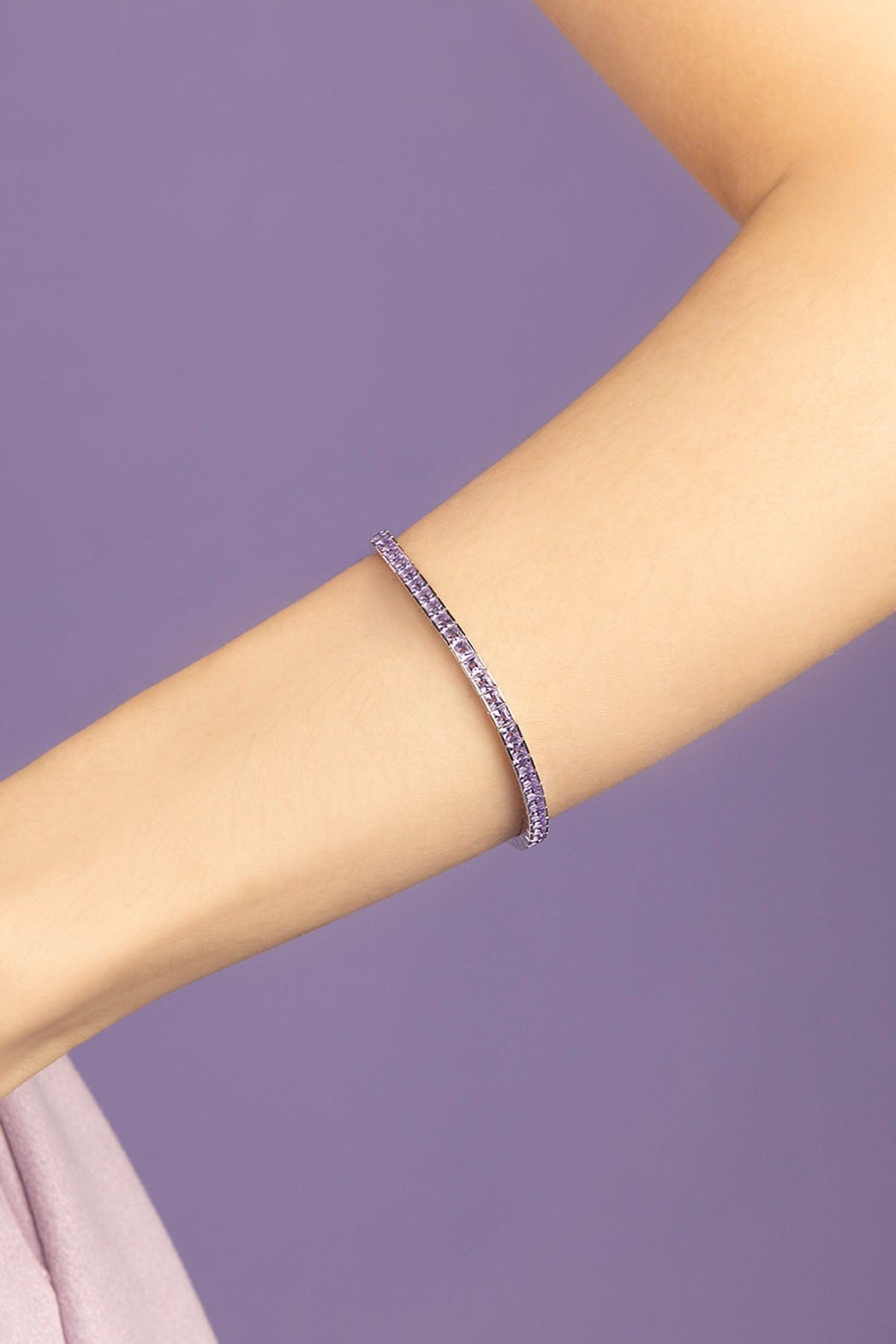 APM Monaco Purple paved bracelet on purple background