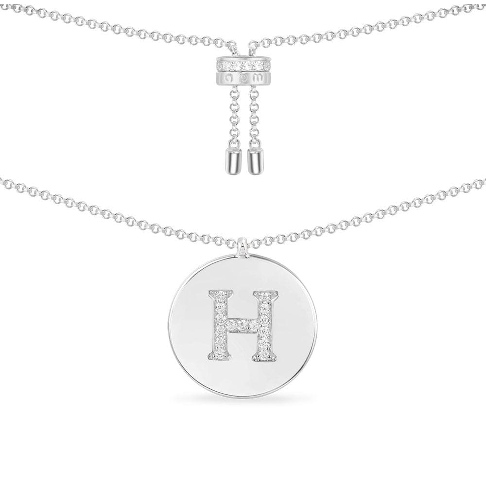 Necklaces APM Monaco — white-tone sterling silver chain with a round pave charm featuring the letter H in rhinestones.