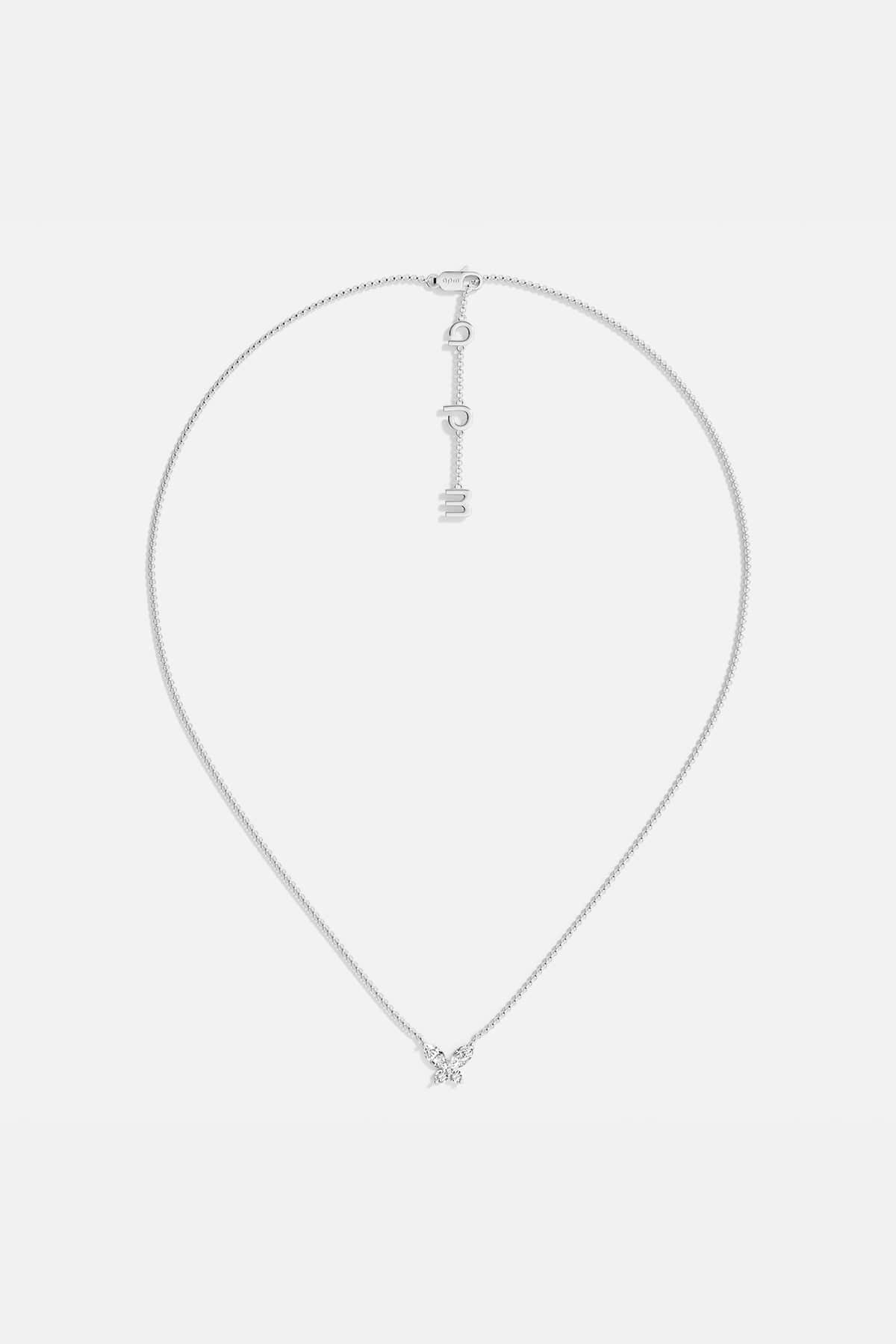 Necklaces APM Monaco. White gold butterfly necklace with white cubic zirconia on a silver chain; butterfly pendant and APM clasp.