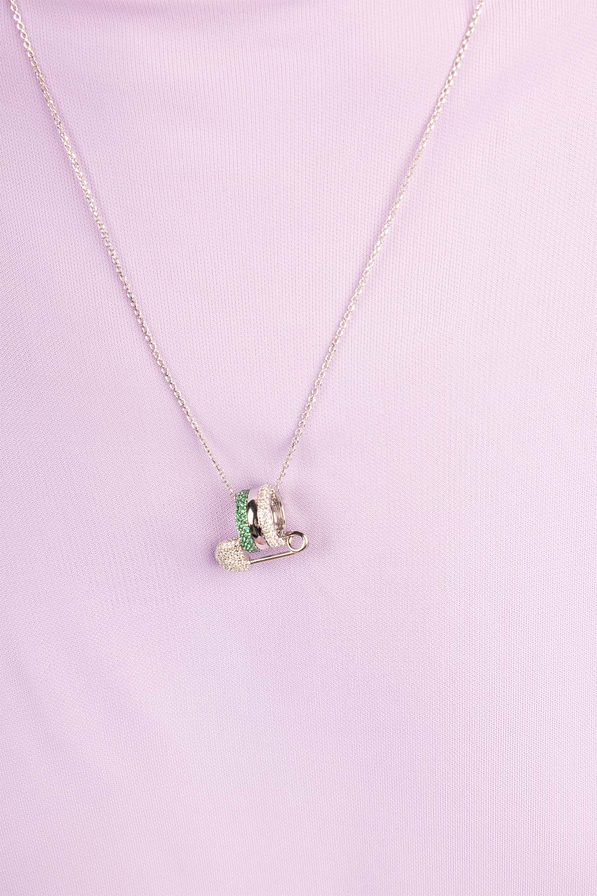 Necklace with a heart-shaped pendant on a pink background