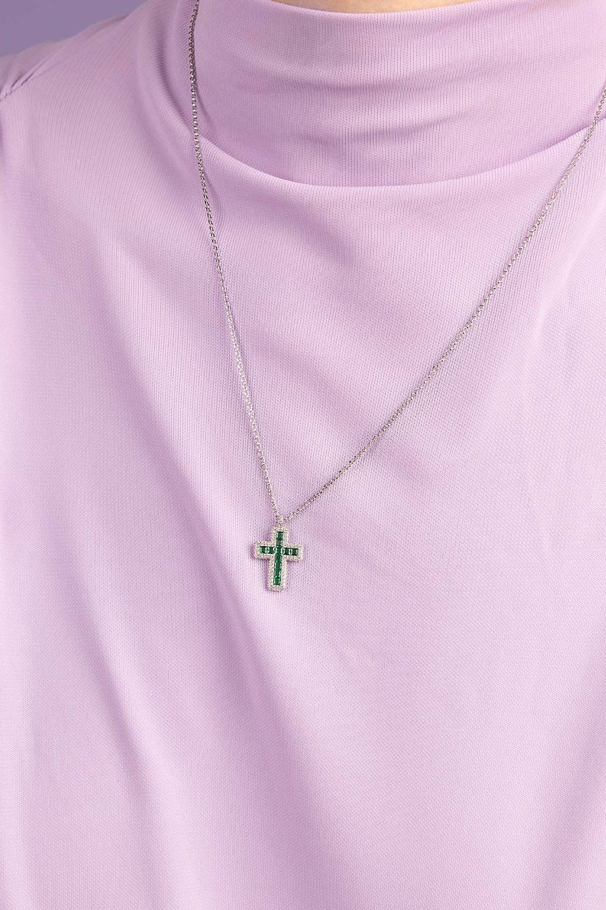APM Monaco Green Pave Cross Adjustable necklace wearing a light purple top against a purple background