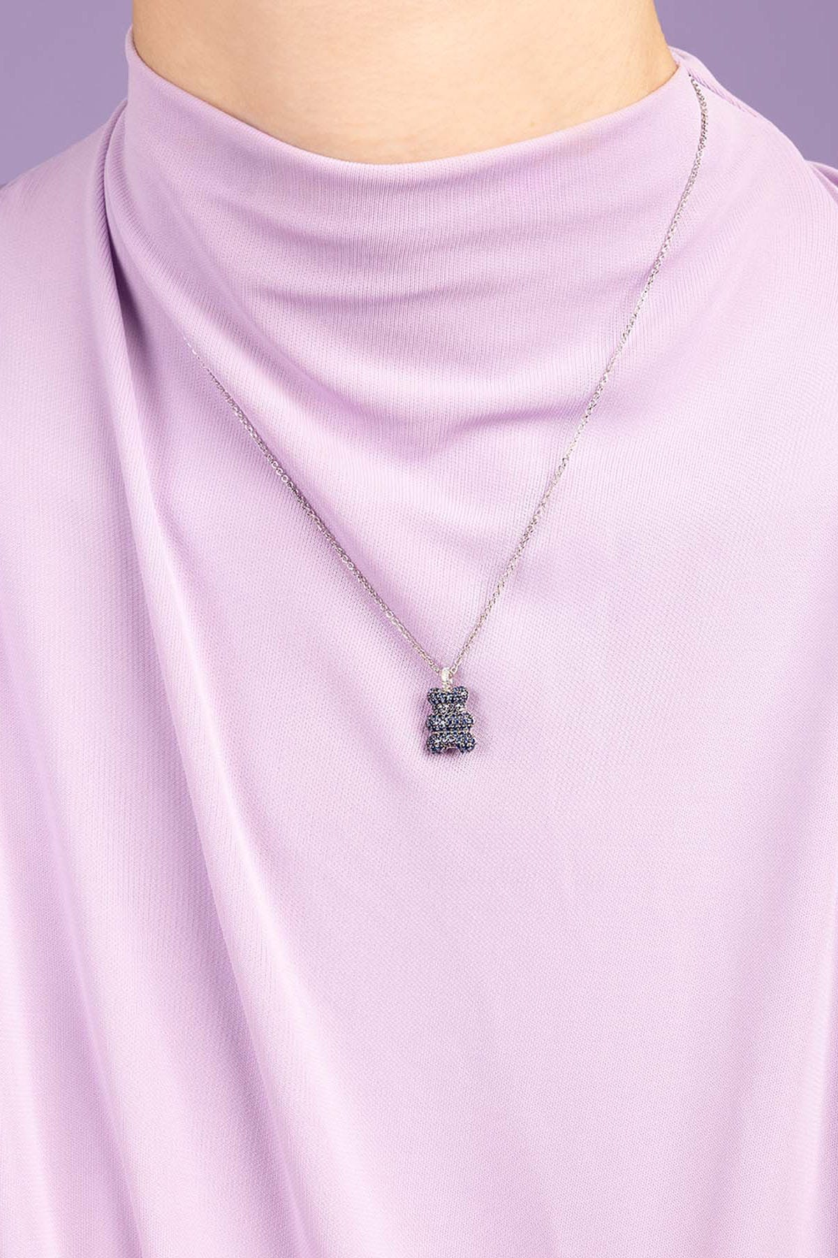 APM Monaco Baby Baba Yummy Bear Adjustable Necklace worn on model with lilac background
