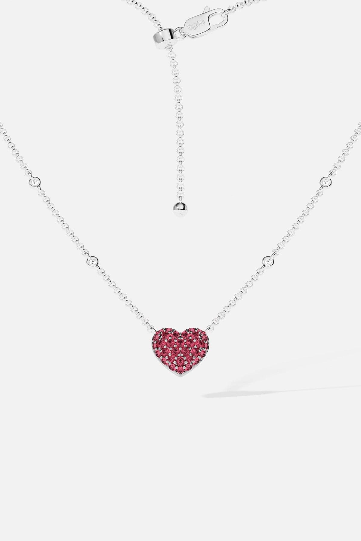 APM MONACO necklace with a heart-shaped fuchsia pendant on a white background