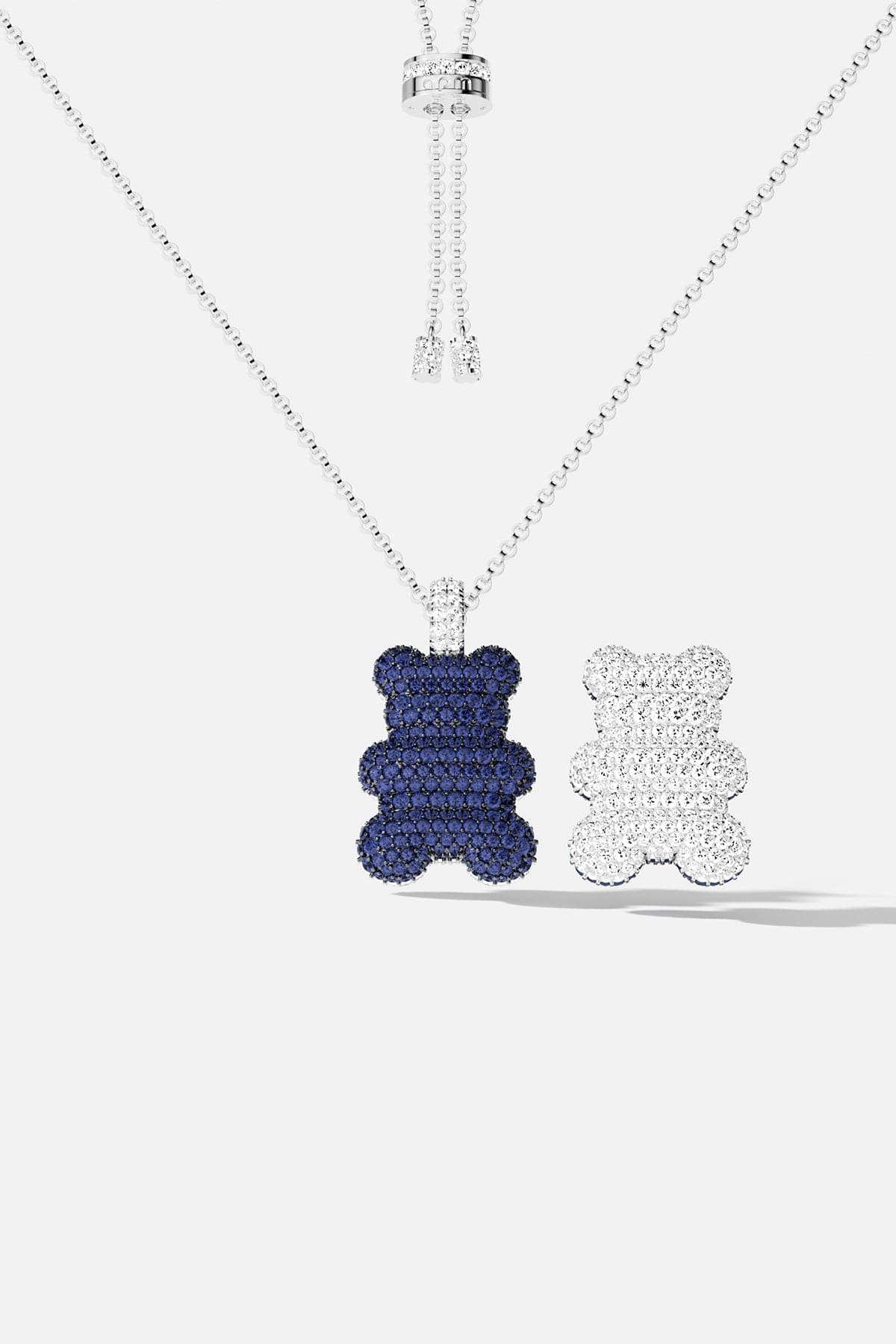 Necklaces APM Monaco; silver chain with two bear-shaped pendants in blue and white.
