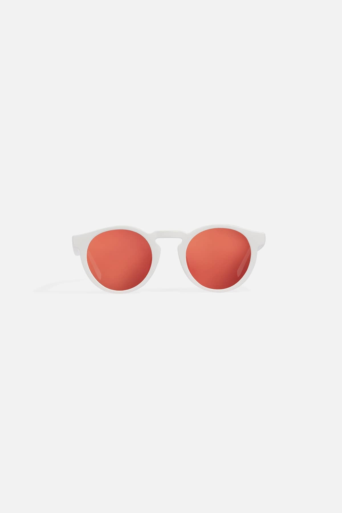 APM MONACO sunglasses with red lenses and white frame on a white background