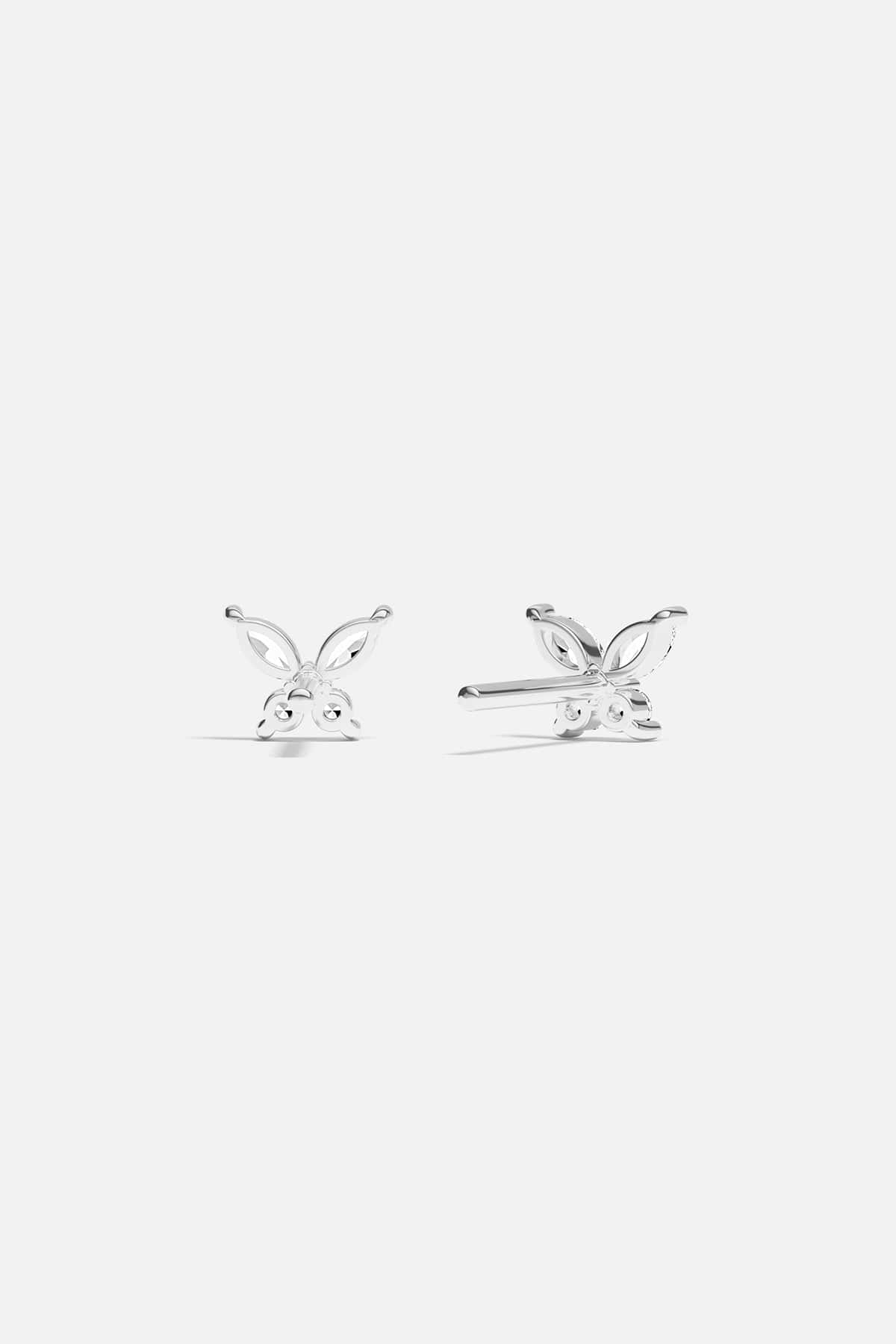 Earrings APM Monaco butterfly stud earrings in silver with gem-encrusted wings.