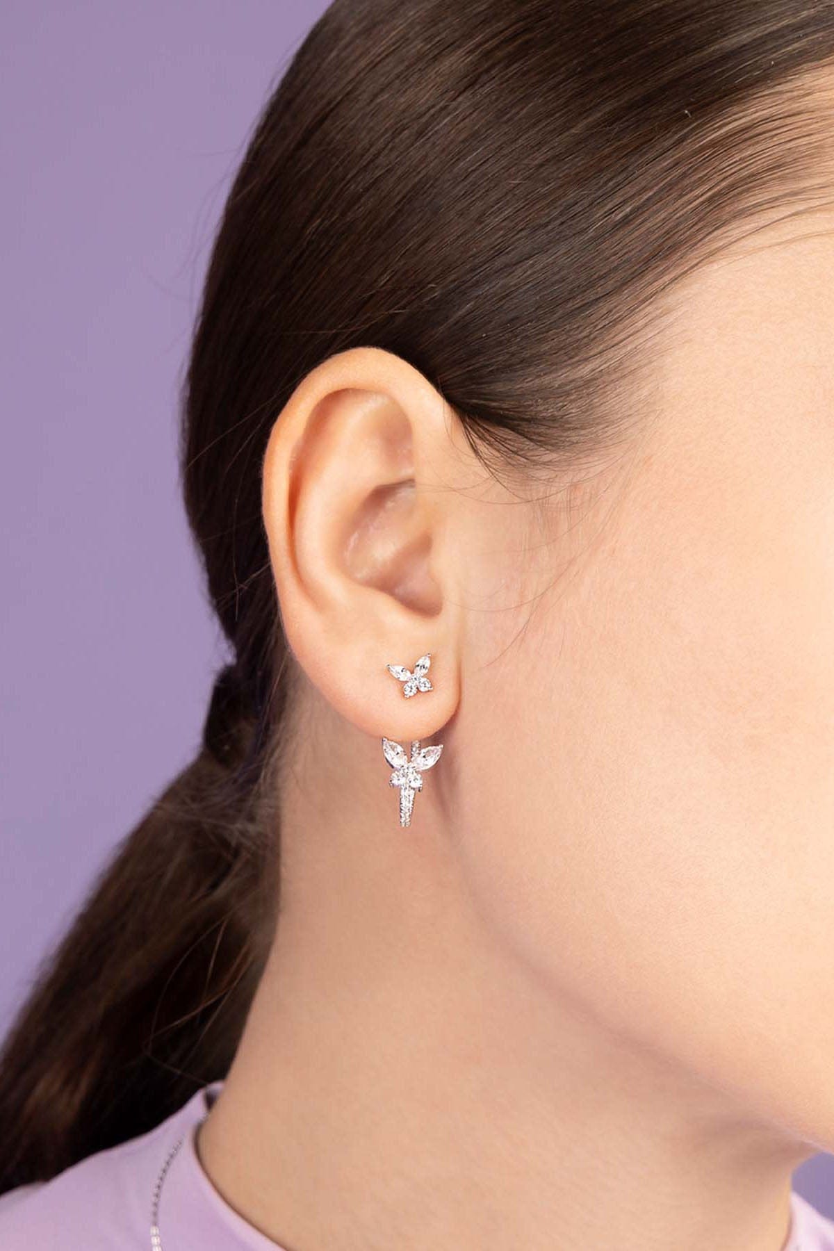 APM Monaco Asymmetric Butterfly Earring Worn on ear