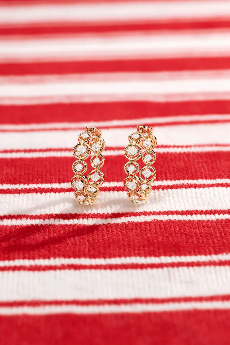 APM Monaco Yellow Les Bulles Earrings on a red and white background