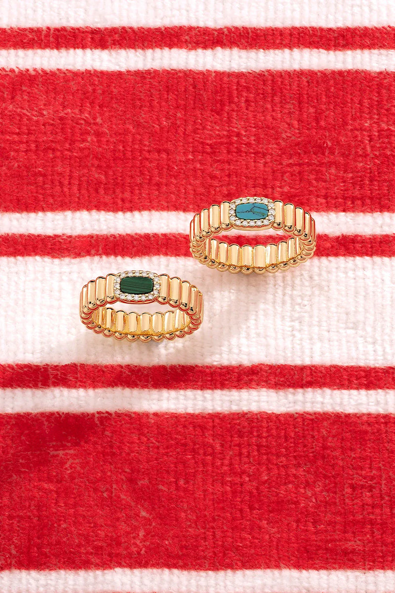 APM Monaco Yellow Le Calanques RIngs on a red and white background