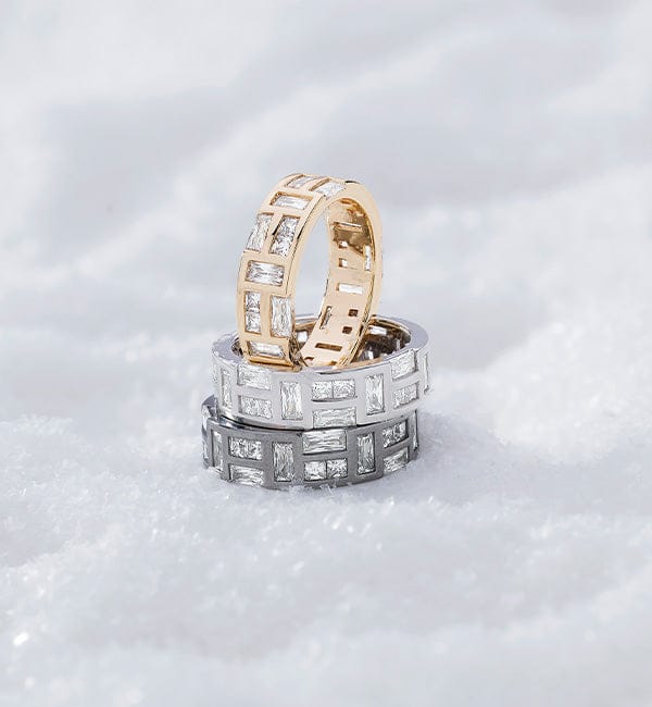 Two APM MONACO hiver rings stacked on a white background