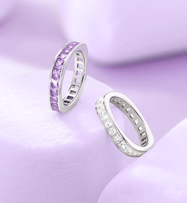 APM Monaco Lumiere rings on lilac background