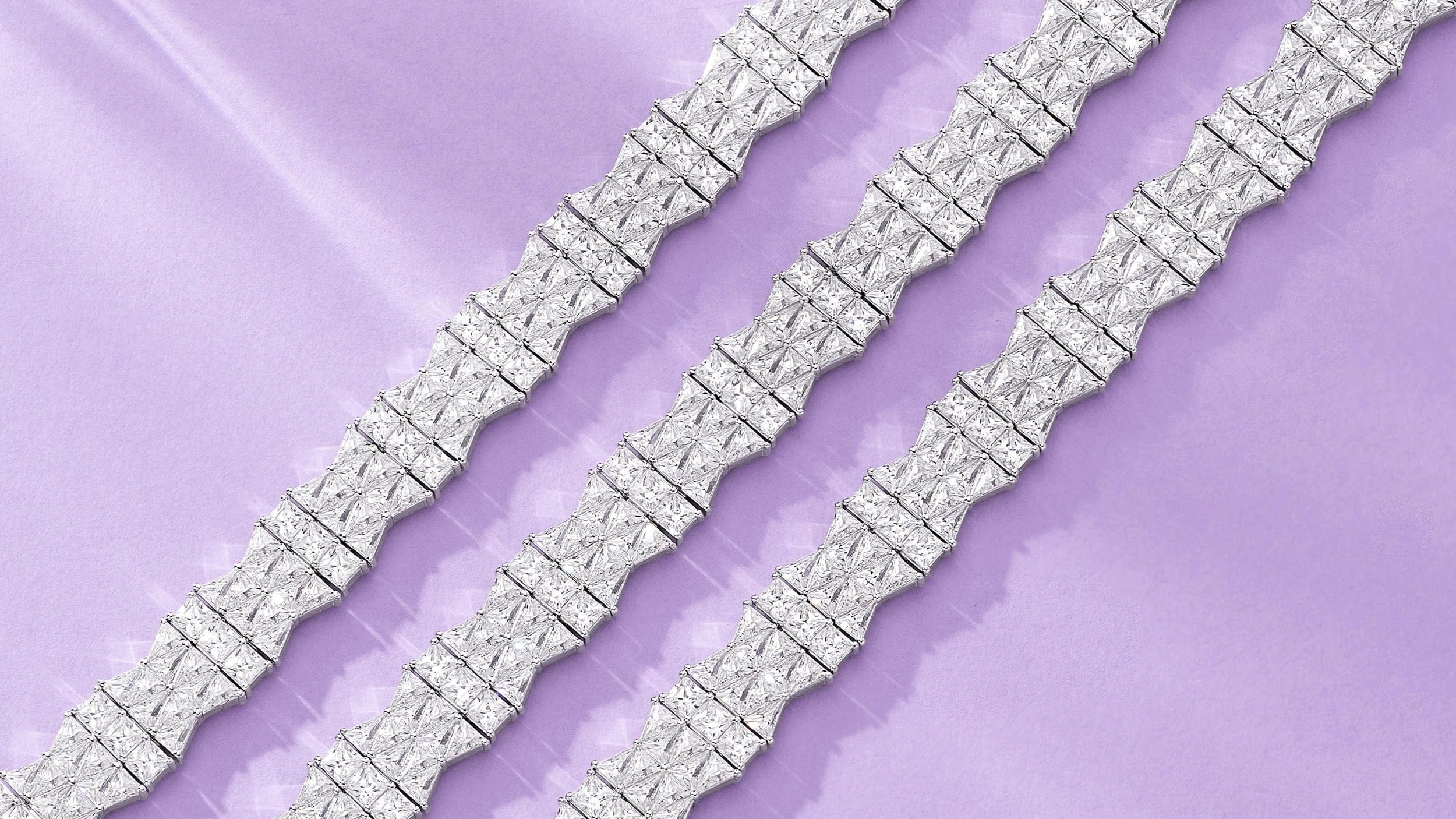 APM MONACO silver Printemps bracelets on a light purple background