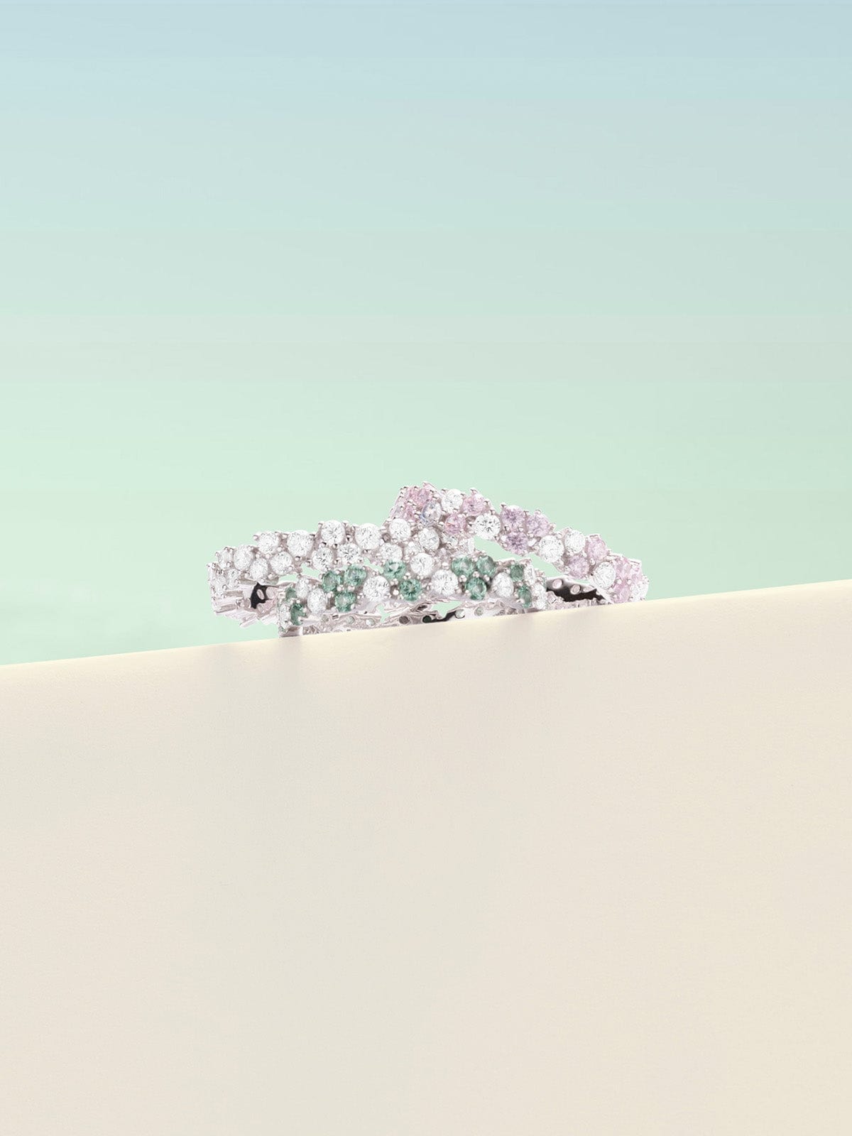 APM Monaco Festival Drop Rings with blue pastel background