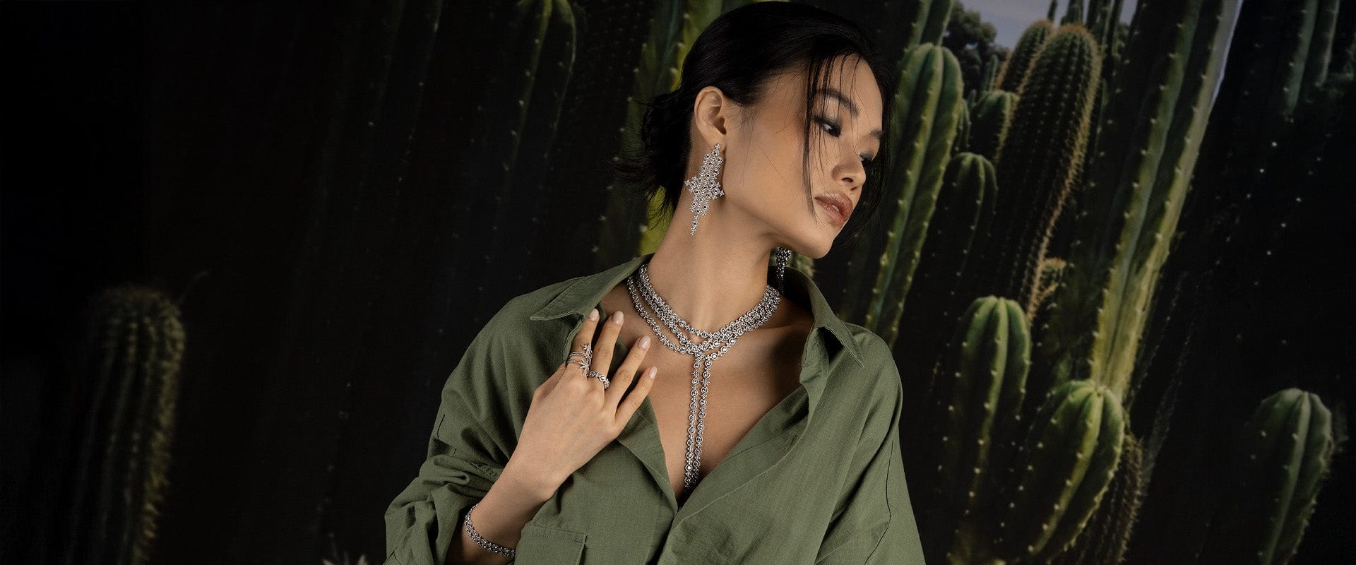 Woman wearing Meteorites jewels with cacti in the background
