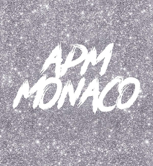 APM Monaco gift card on a glittery silver background