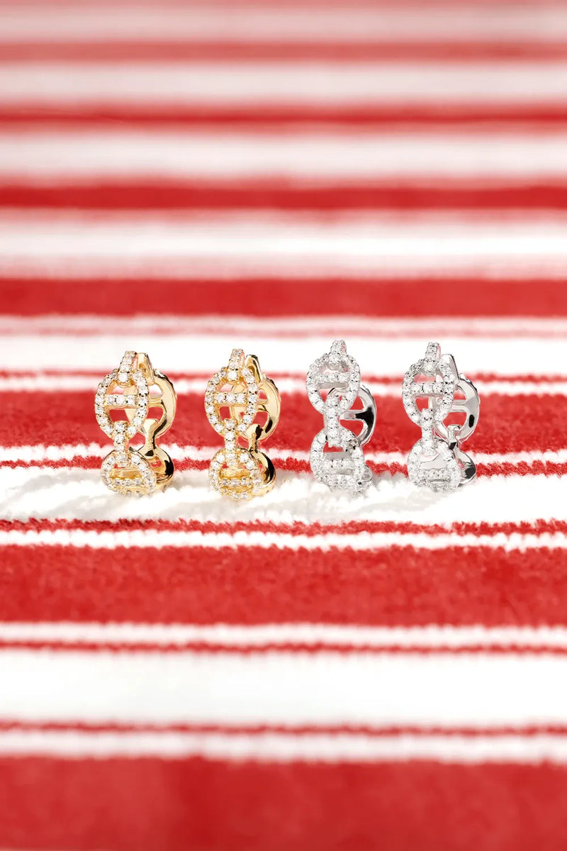 APM Monaco Yellow and White Yacht Club earrings on a red and white background