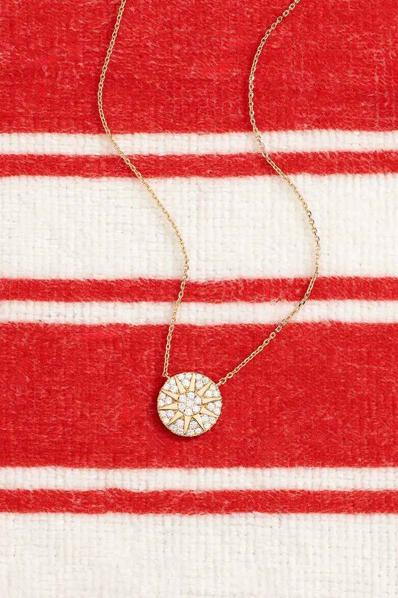 APM Monaco Yellow Soleil Necklace on a red and white background
