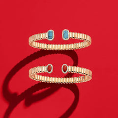 APM Monaco Yellow Les Calanques Bracelet on a red background