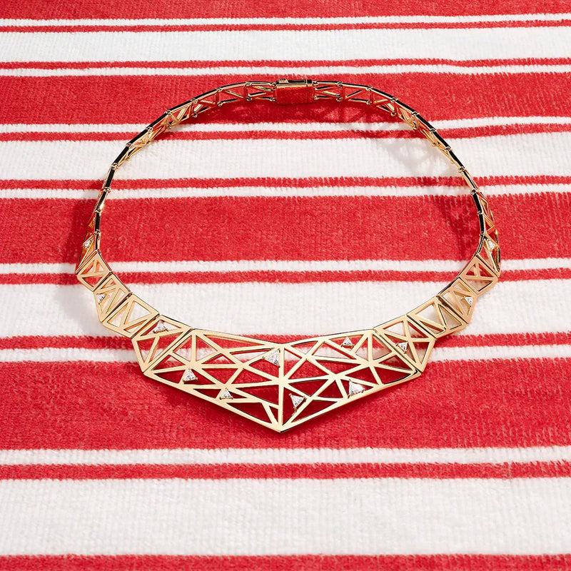 APM Monaco Yellow Labyrinth Choker on a red and white background