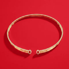 APM Monaco Yellow Les Calanques choker on a red background