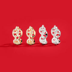APM Monaco Yellow and White Yacht club earrings on a red background