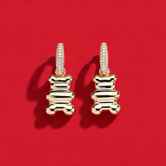 APM Monaco Yellow Yummy earrings on a red background