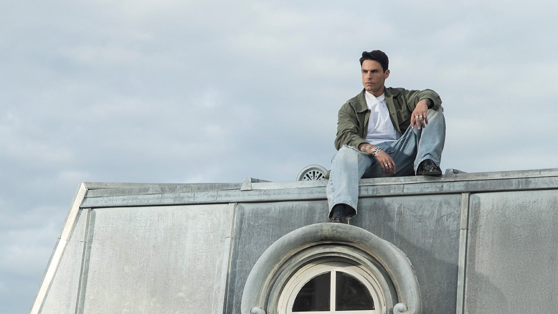 APM Monaco Collection Yummy baptiste giabiconi Sitting on city roof with sky background