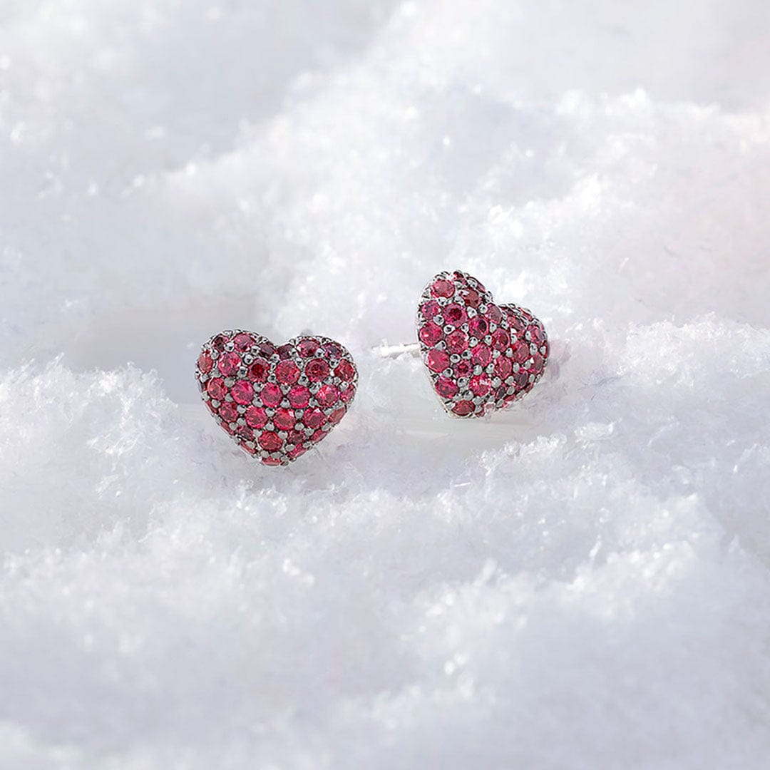 APM MONACO Heart-shaped earrings with pink stones on a white background