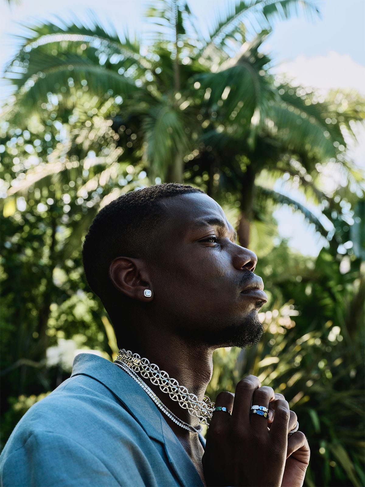 Paul Pogba wearing APM Monaco pave and yacht club maille marine necklaces and pave earring